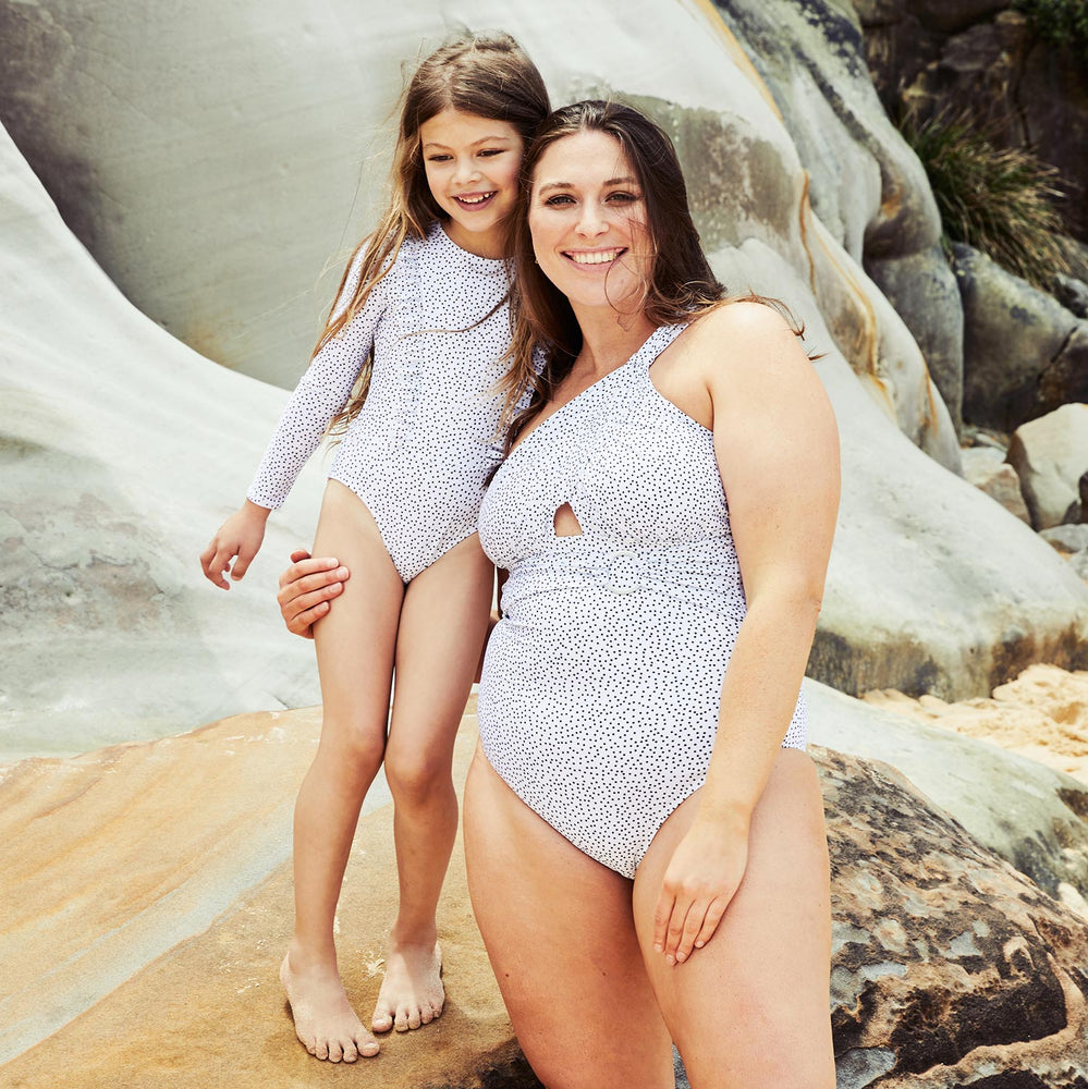 Little-Halle-surfsuit-long-sleeve-and-Angelica-one-piece-dots-white-4-contessa-volpi-swimwear